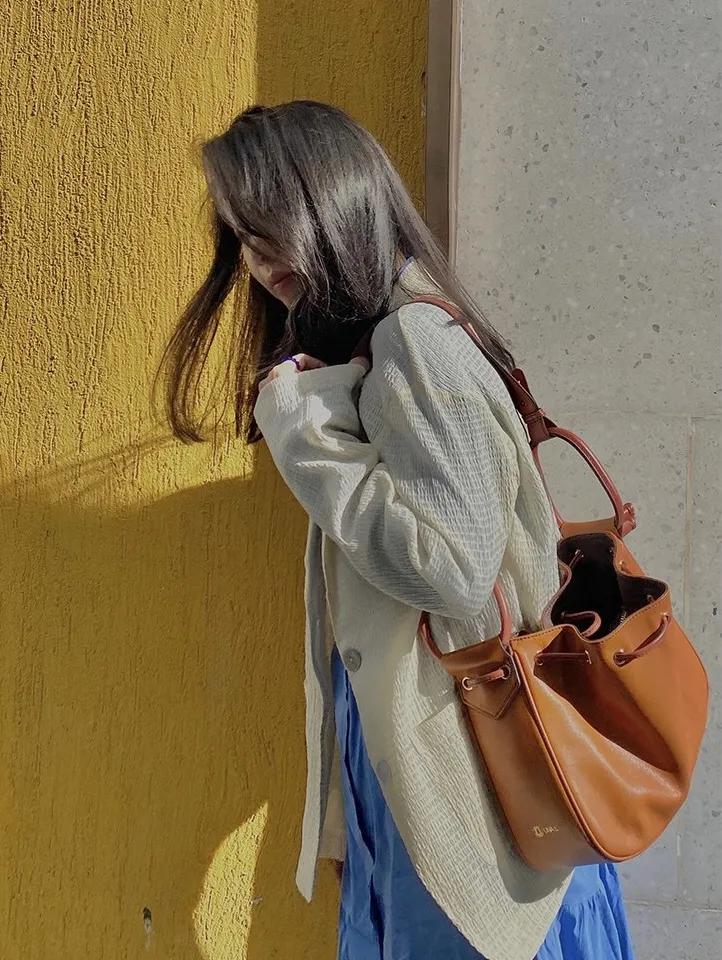 买了一大堆便宜包包,买了一个包回来发现包里有钱